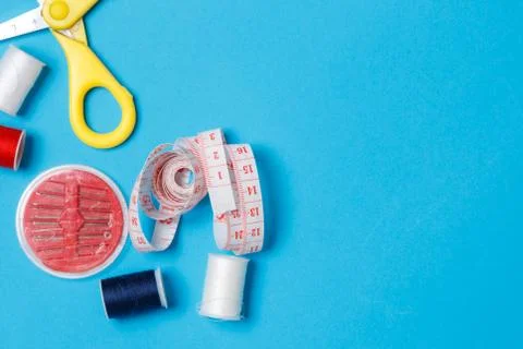 Thread Spools Tailor Equipment On Blue Background Stock Photos