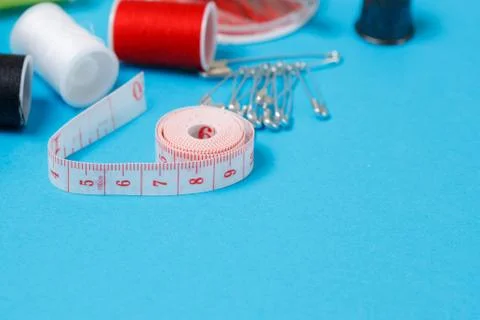 Thread Spools Tailor Equipment On Blue Background Stock Photos