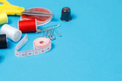 Thread Spools Tailor Equipment On Blue Background Stock Photos