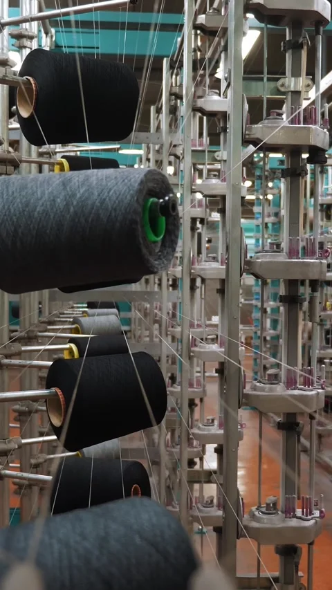 Thread spools. textile industry. weaving factory. racks with many thread spools. Stock Footage 317703775