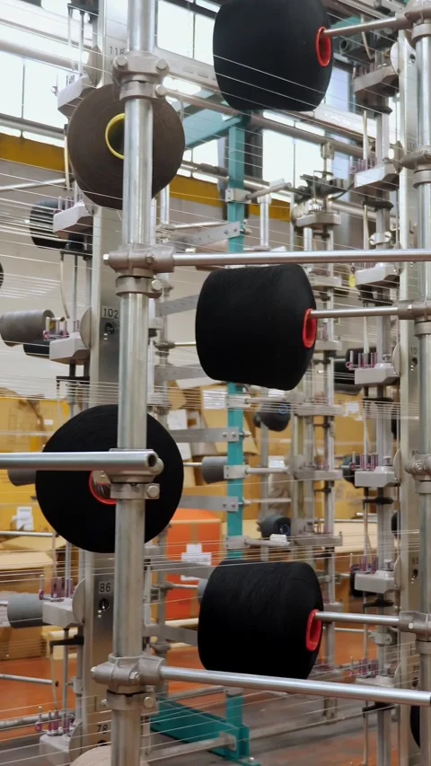 Thread spools. textile industry. weaving factory. racks with many thread spools. Stock Footage 317849779