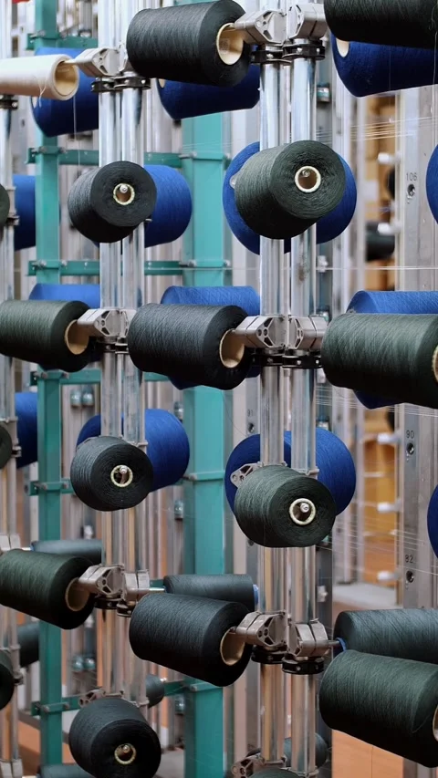 Thread spools. textile industry. weaving factory. racks with many thread spools. Stock Footage 318240253