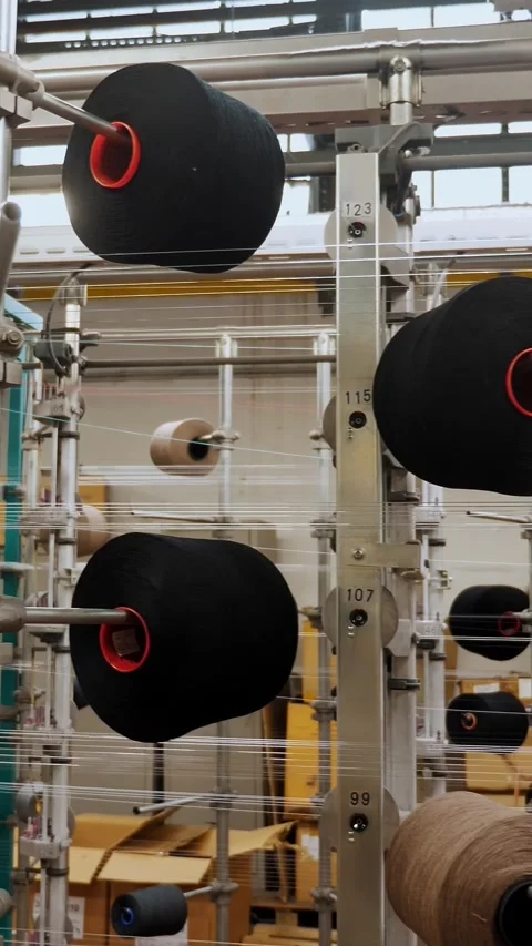 Thread spools. textile industry. weaving factory. racks with many thread spools. Stock Footage 319941852