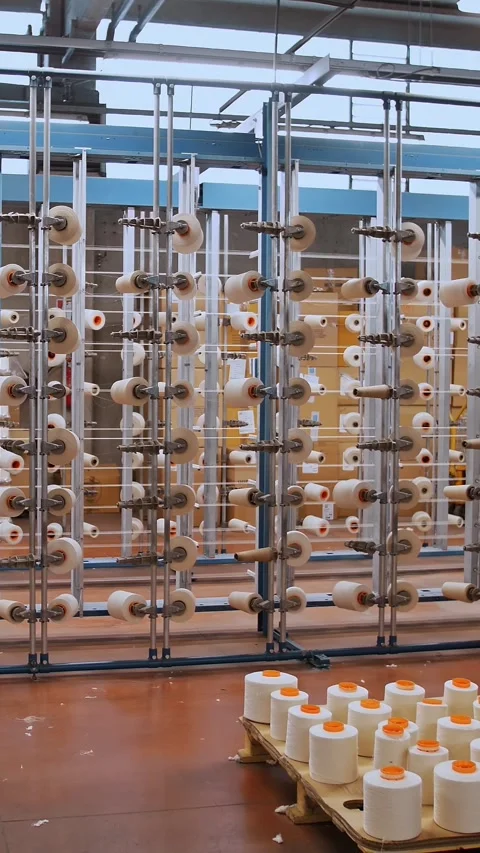 Thread spools. textile industry. weaving factory. racks with many thread spools. Video stock 320534764