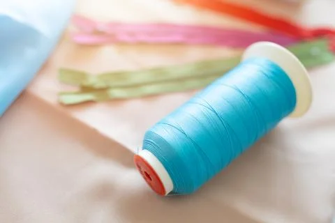 Thread spools for weaving in automatic sewing machines in Tailor colorful i.. Stock Photos