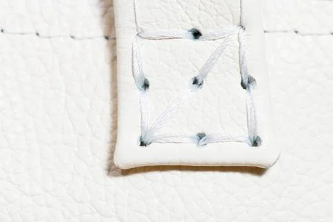 Thread stitch on white leather Stock Photos