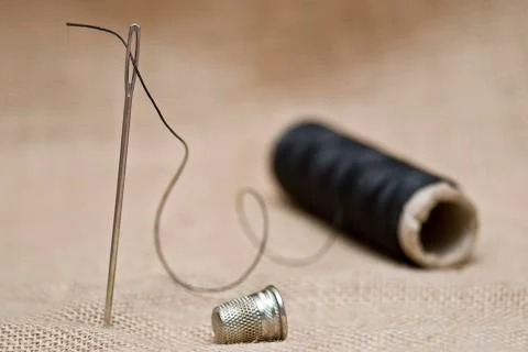 Thread, thimble and needle. Stock Photos