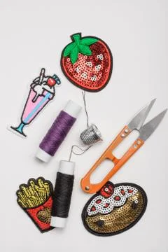 Thread, thimble, scissors and patches Stock Photos