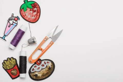 Thread, thimble, scissors and patches Stock Photos