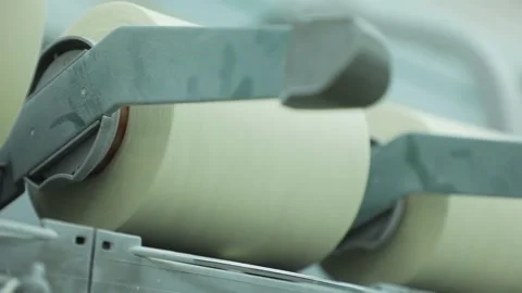 Thread is unwound from the spool, close Stock Footage 229946995