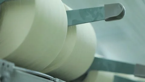 Thread is unwound from the spool Stock Footage 229947162
