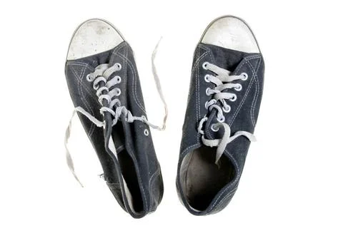 Threadbare gym-shoes Threadbare gym-shoes isolated over white background (... Stock Photos