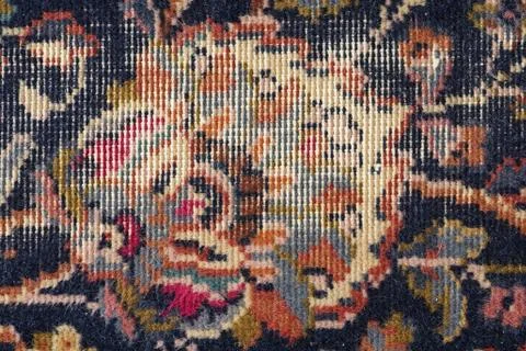 Threadbare old carpet detail Stock Photos
