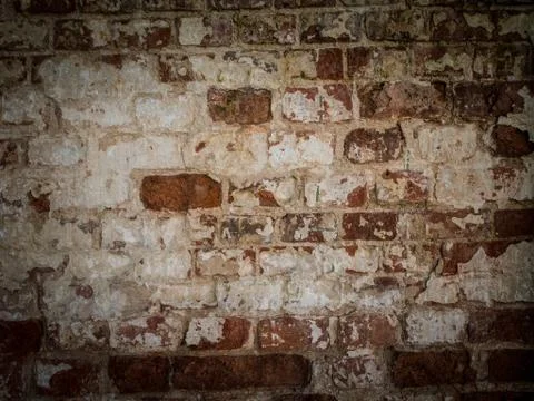 Threadbare surface of ancient masonry. Abstract background with old brick wall. Stock Photos