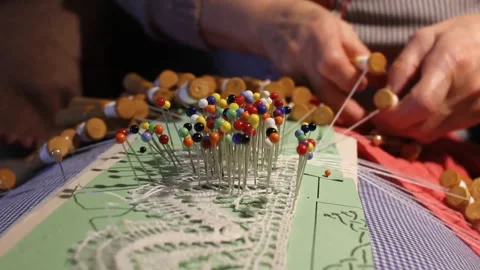 Threade wisdom: octogenarian's bobbin lace mastery Stock Footage 258619185