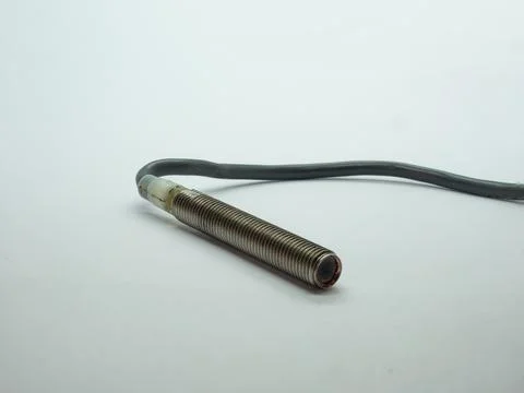 Threaded  inductive proximity sensor with cable used in industrial automation Stock Photos