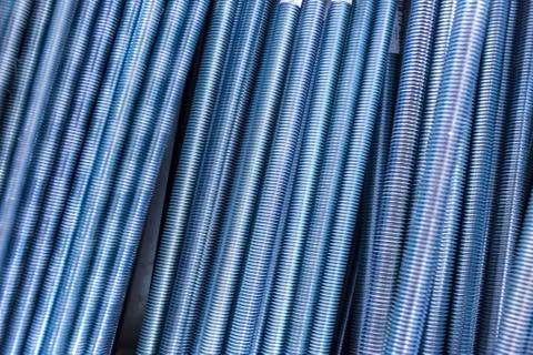 Threaded metal rods. Technological background or texture. A number of threaded Stock Photos
