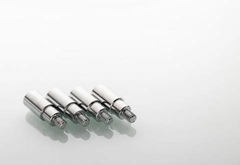 Threaded metal tips for light stands with reflection in glass Stock Photos