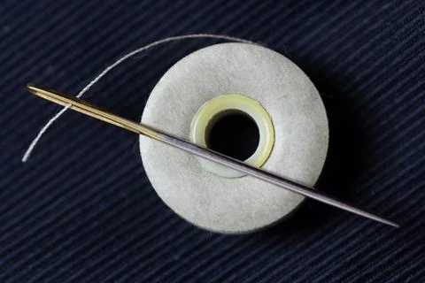 Threaded needle close up Stock Photos