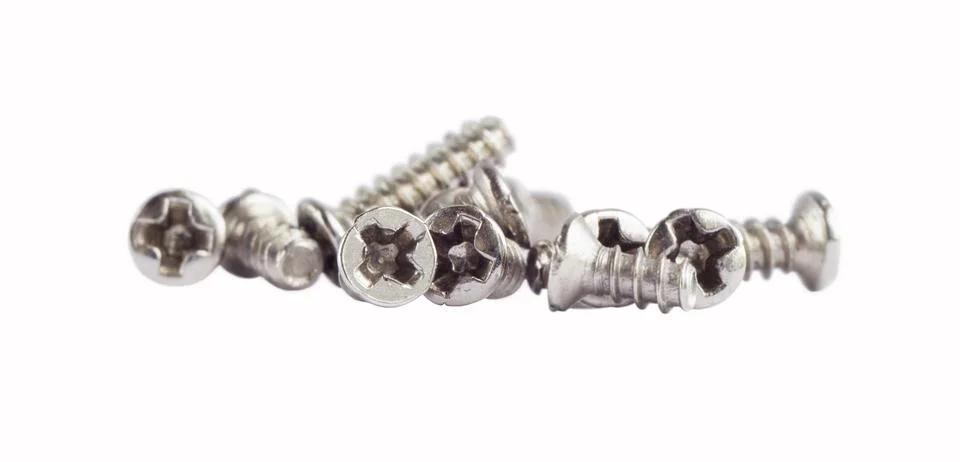 Threaded screws isolated on a white background, close-up Stock Photos