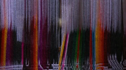 Threading Back of Strings of Fabric Stock Footage 109188574