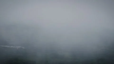 Threading Between Invisible Ridges Smothered by Dense Brume Stock Footage 316798956