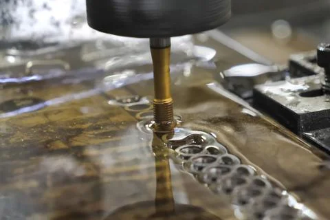 Threading in machine oil, threading in cylinders, injection packers, producti Stock Photos