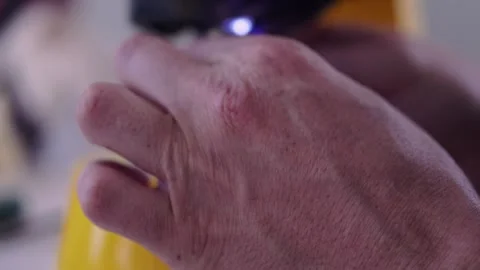 Threading a needle into a sewing machine Stock Footage 308727724