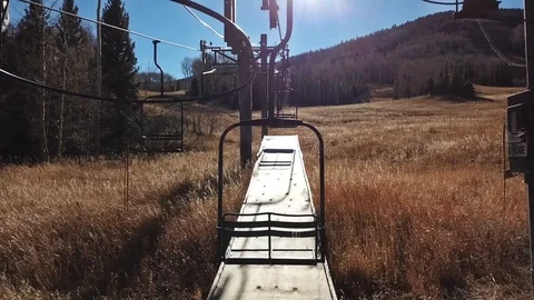 Threading the needle through a ski resort chairlift Stock Footage 86338573