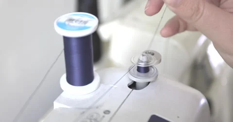 Threading A Sewing Machine - 120 FPS Stock Footage 136782648