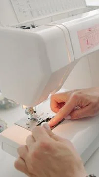 Threading a sewing needle Stock Photos