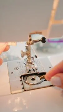 Threading a sewing needle Stock Photos