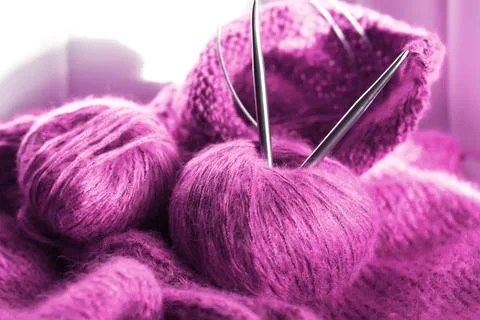 Threads and knitting needles. Knitting blankets. Knitted sweater. Needlework  Stock Photos