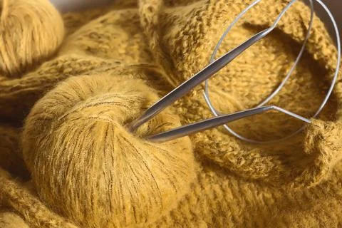 Threads and knitting needles. Knitting blankets. Knitted sweater. Needlework  Stock Photos