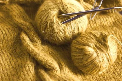 Threads and knitting needles. Knitting blankets. Knitted sweater. Needlework  Stock Photos
