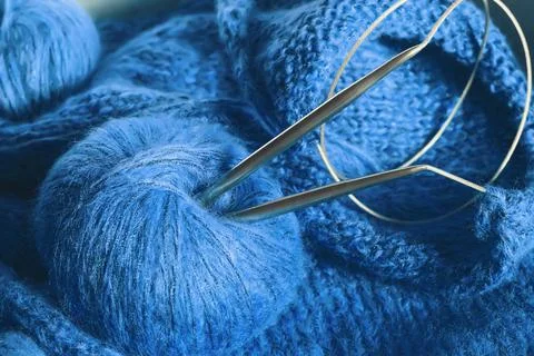 Threads and knitting needles. Knitting blankets. Knitted sweater. Needlework  Stock Photos