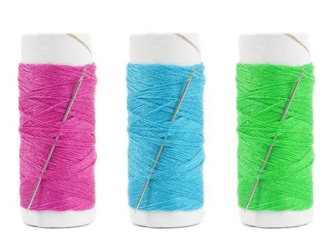 Threads and needle closeup on white Stock Photos