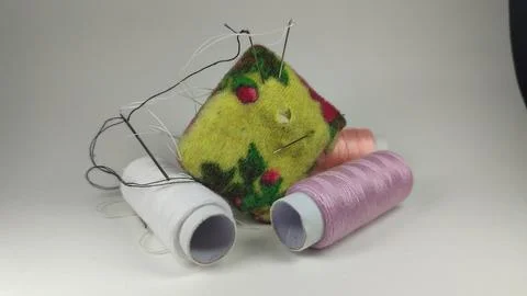 Threads and needles. Sewing clothes. Stock Photos