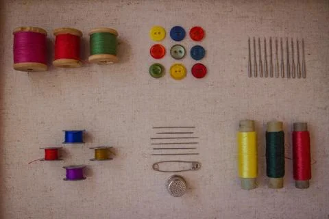 Threads and needles for sewing. Stock Photos