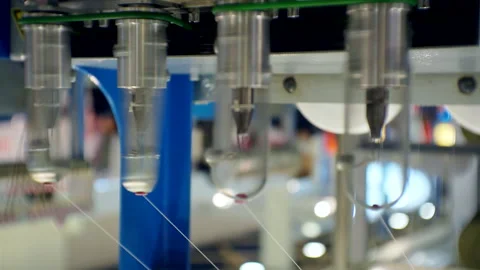 Threads are pulled through the rotating parts of the textile machinery.close-up. Video stock 150018175