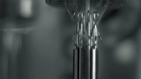 The threads are woven into a strong rope on a loom. Close-up. Macro Stock Footage 179713372