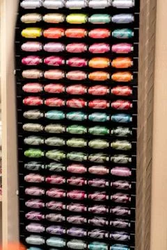 Threads in coils on the stand. Stock Photos