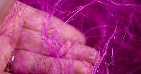 Threads for creativity close up, artificial threads dyed red for decorative work Stock Footage 313574745