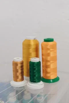 Threads of different colors on an embroidery machine. hobby, creative girl Stock Photos
