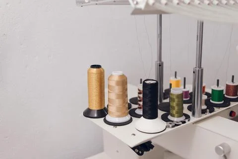 Threads of different colors on an embroidery machine. hobby, creative girl Stock Photos