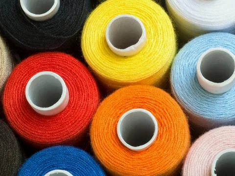Threads of different colors on spools, standing vertically,top view,detail Stock Photos