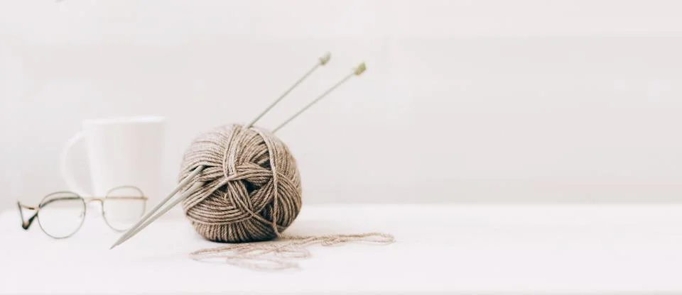 Threads for knitting, from natural environmentally friendly wool, close-up on a Stock Photos