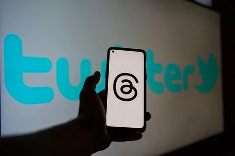 Threads logo on screen, Twitter logo in the background Stock Photos