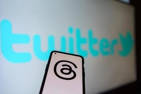 Threads logo on screen, Twitter logo in the background Stock Photos