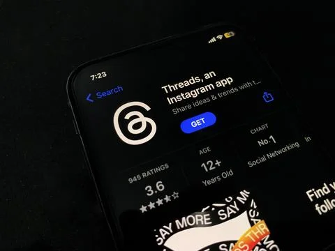 Threads on mobile installation screen with black night mode on. Stock Photos